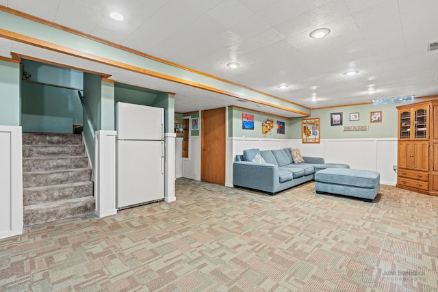 7 Farmington Ct, Lake In The Hills, IL 60156 - living area featuring light carpet, a wainscoted wall, and stairs