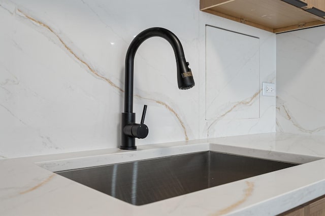 33 E Cedar St Unit 6B, Chicago, IL 60611 - kitchen view of a sink and light stone counters