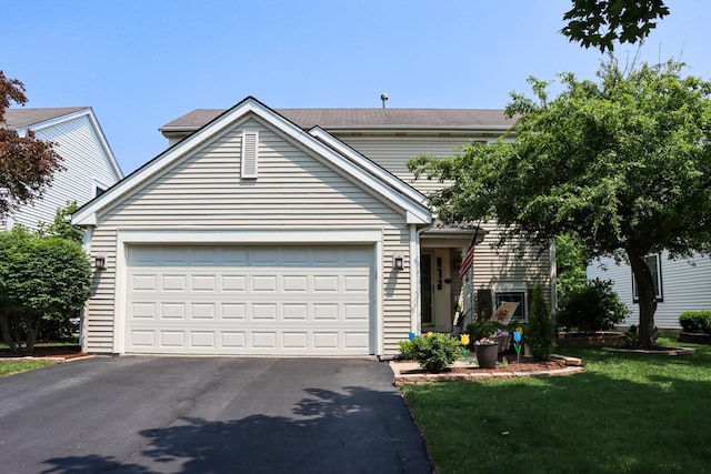 1024 Lakestone Ln, Aurora, IL 60504 - view of front facade with driveway, a garage, and a front lawn