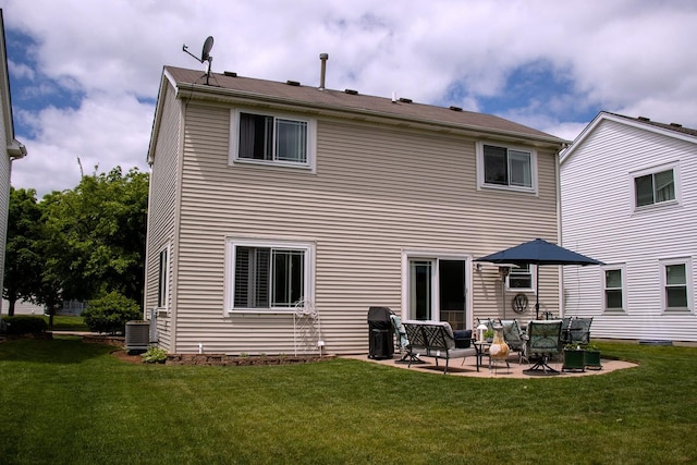 1024 Lakestone Ln, Aurora, IL 60504 - rear view of house with a yard, a patio, and central AC unit