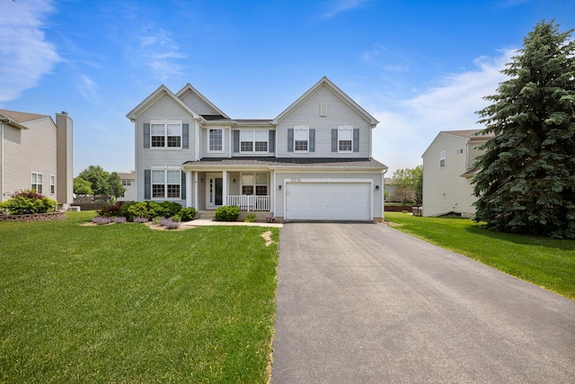 17738 S Willard Ln, Lockport, IL 60441 - view of front of house featuring a porch, driveway, a front lawn, and a garage