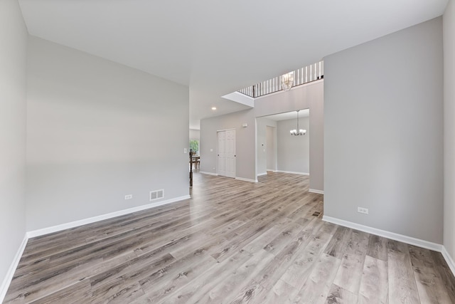 17738 S Willard Ln, Lockport, IL 60441 - empty room with a chandelier, baseboards, light wood finished floors, and recessed lighting