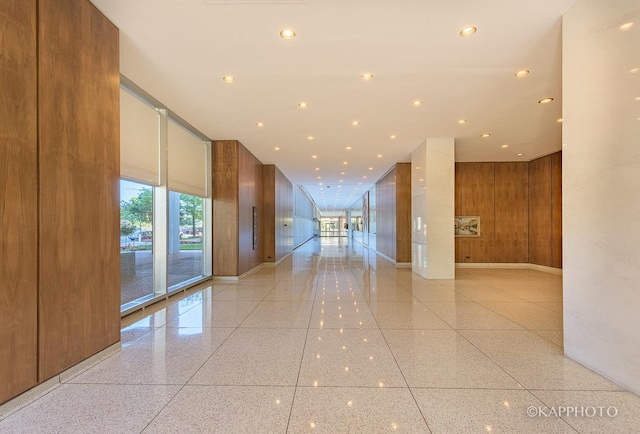 3600 N Lake Shore Dr Unit 1603, Chicago, IL 60613 - corridor featuring dark aggregate flooring, wooden walls, and recessed lighting