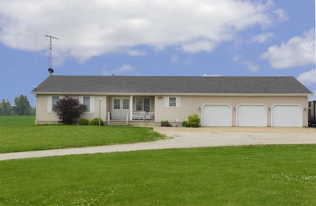 2098 N 15th Rd, Streator, IL 61364 - ranch-style home with gravel driveway, covered porch, a garage, and a front lawn