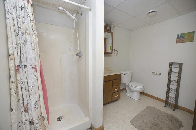 2098 N 15th Rd, Streator, IL 61364 - full bath featuring a drop ceiling, a shower stall, toilet, vanity, and baseboards