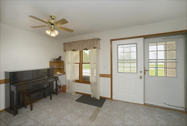 2098 N 15th Rd, Streator, IL 61364 - doorway with baseboards, ceiling fan, and light tile patterned floors