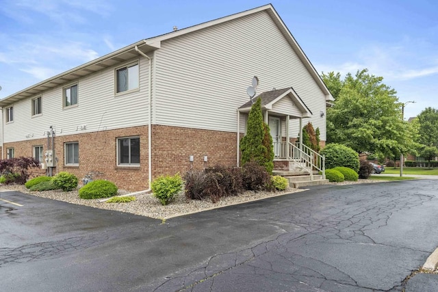 9810 Parkway Dr None, Unit None, Highland, IN 46322 - view of property exterior with brick siding