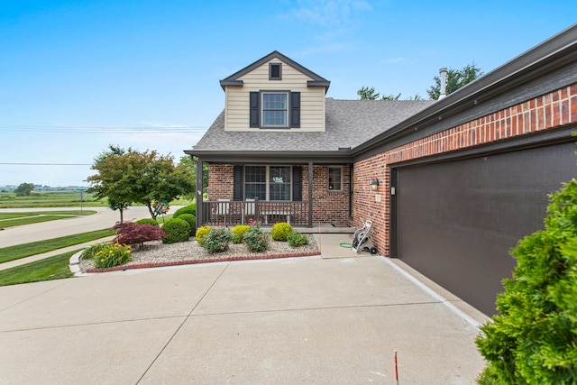 2910 Greystone Pl, Champaign, IL 61822 - view of front of property featuring brick siding, concrete driveway, covered porch, roof with shingles, and an attached garage