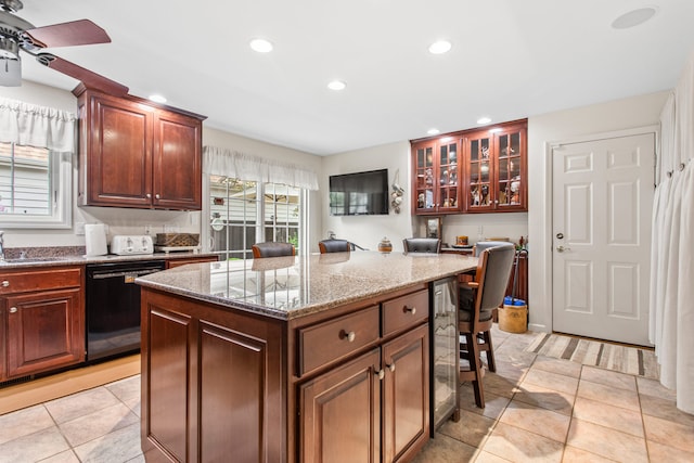 2910 Greystone Pl, Champaign, IL 61822 - kitchen with dishwasher, recessed lighting, a kitchen island, light stone countertops, and beverage cooler