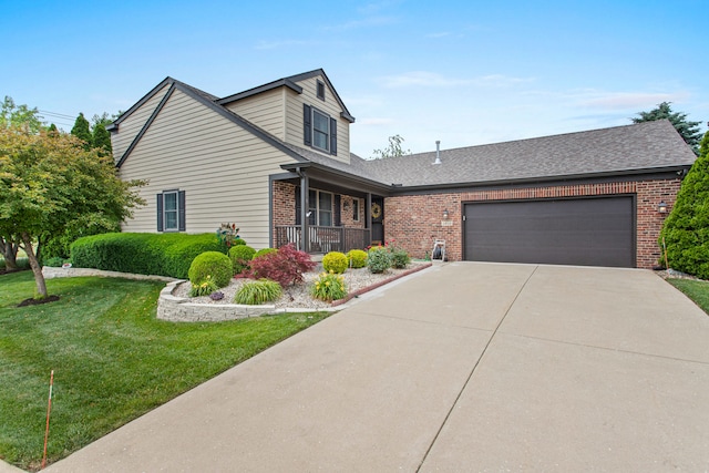 2910 Greystone Pl, Champaign, IL 61822 - traditional-style home with brick siding, covered porch, concrete driveway, a front yard, and an attached garage