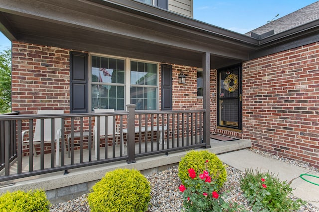 2910 Greystone Pl, Champaign, IL 61822 - view of exterior entry featuring a porch and brick siding