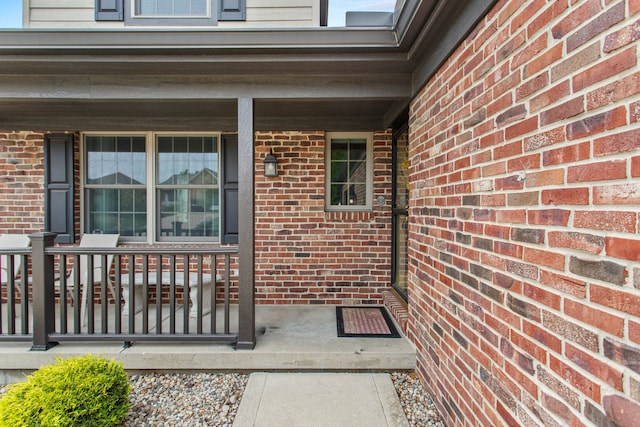 2910 Greystone Pl, Champaign, IL 61822 - view of exterior entry with a porch and brick siding