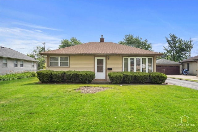 3604 Owl Dr, Rolling Meadows, IL 60008 - bungalow-style home with a front lawn, a detached garage, and a chimney