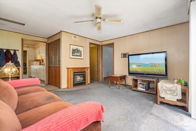 3604 Owl Dr, Rolling Meadows, IL 60008 - living room featuring carpet flooring, a ceiling fan, and a warm lit fireplace