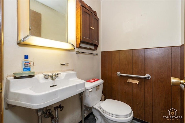 3604 Owl Dr, Rolling Meadows, IL 60008 - bathroom featuring toilet and a wainscoted wall