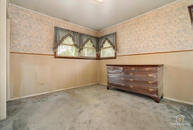 3604 Owl Dr, Rolling Meadows, IL 60008 - empty room featuring wallpapered walls, wainscoting, ornamental molding, and carpet flooring