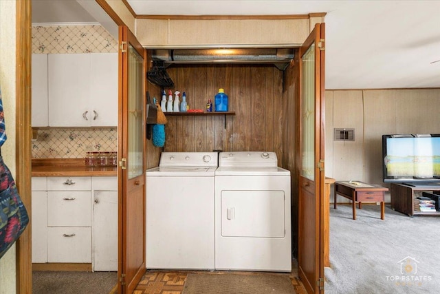 3604 Owl Dr, Rolling Meadows, IL 60008 - washroom featuring separate washer and dryer, wooden walls, and light colored carpet