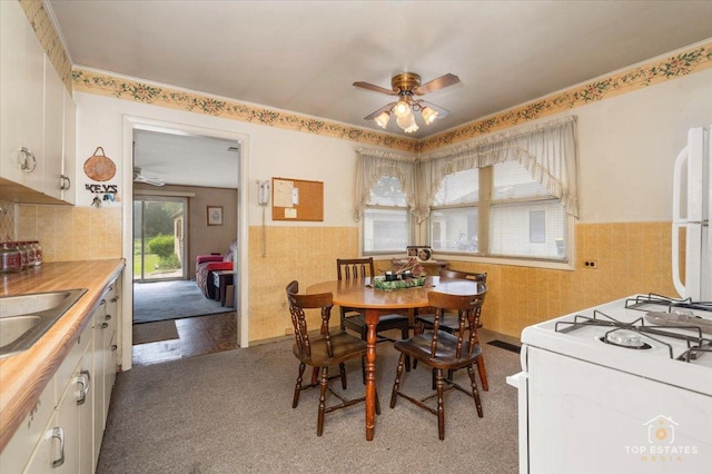 3604 Owl Dr, Rolling Meadows, IL 60008 - carpeted dining room with ceiling fan and wainscoting