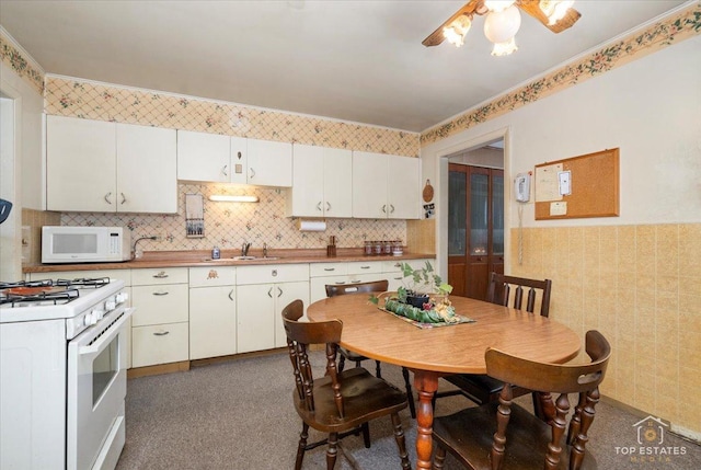 3604 Owl Dr, Rolling Meadows, IL 60008 - kitchen featuring white appliances, a ceiling fan, white cabinetry, and dark carpet