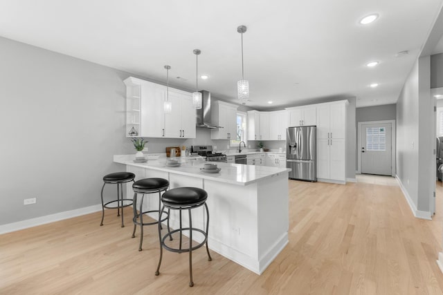4113 Eberly Ave, Brookfield, IL 60513 - kitchen with appliances with stainless steel finishes, a peninsula, wall chimney range hood, open shelves, and baseboards