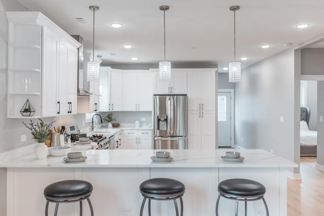 4113 Eberly Ave, Brookfield, IL 60513 - kitchen featuring stainless steel appliances, a peninsula, light stone counters, white cabinets, and recessed lighting