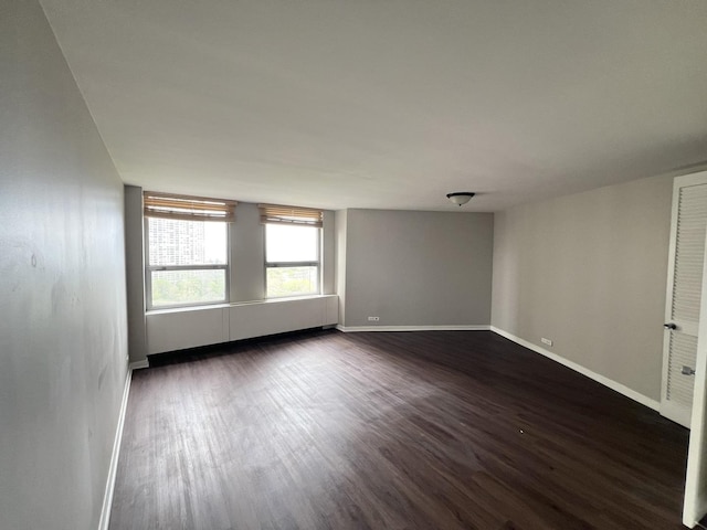 2626 N Lakeview Ave Unit 1509, Chicago, IL 60614 - unfurnished room with dark wood-style floors and baseboards