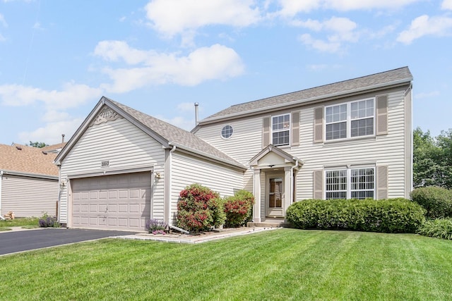 2802 Forestview Dr, Carpentersville, IL 60110 - view of front of house with a garage, driveway, a front lawn, and a shingled roof