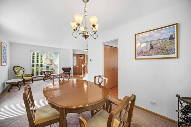 2802 Forestview Dr, Carpentersville, IL 60110 - dining room with a chandelier, light carpet, baseboards, and stairs