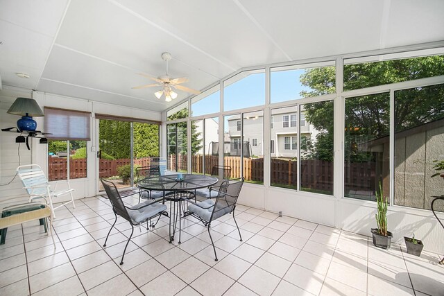 2802 Forestview Dr, Carpentersville, IL 60110 - sunroom / solarium with a ceiling fan, lofted ceiling, plenty of natural light, and outdoor dining area