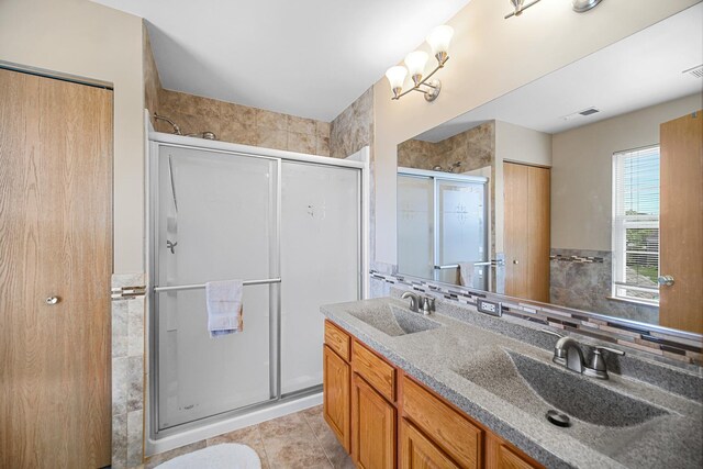 2802 Forestview Dr, Carpentersville, IL 60110 - full bathroom featuring a stall shower, double vanity, and tile patterned floors
