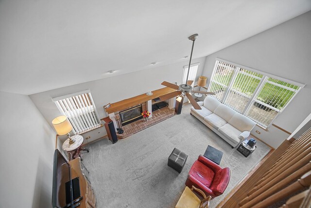 2802 Forestview Dr, Carpentersville, IL 60110 - living area with carpet floors, lofted ceiling, ceiling fan, and a fireplace