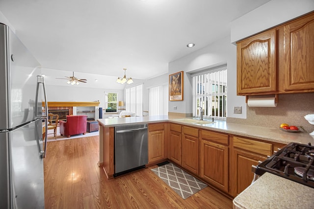 2802 Forestview Dr, Carpentersville, IL 60110 - kitchen with appliances with stainless steel finishes, a sink, plenty of natural light, wood finished floors, and recessed lighting