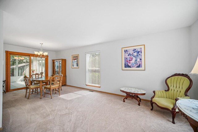 2802 Forestview Dr, Carpentersville, IL 60110 - dining space with a chandelier, carpet, and baseboards