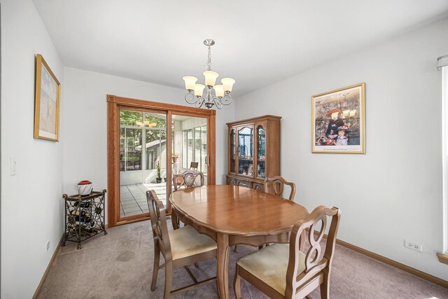2802 Forestview Dr, Carpentersville, IL 60110 - dining room featuring light carpet, a chandelier, and baseboards