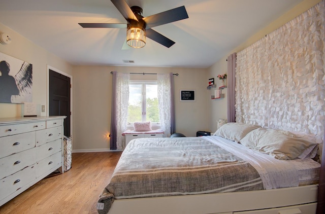14121 Norwich Ln Unit 301, Orland Park, IL 60467 - bedroom featuring light wood-style floors, a ceiling fan, and baseboards