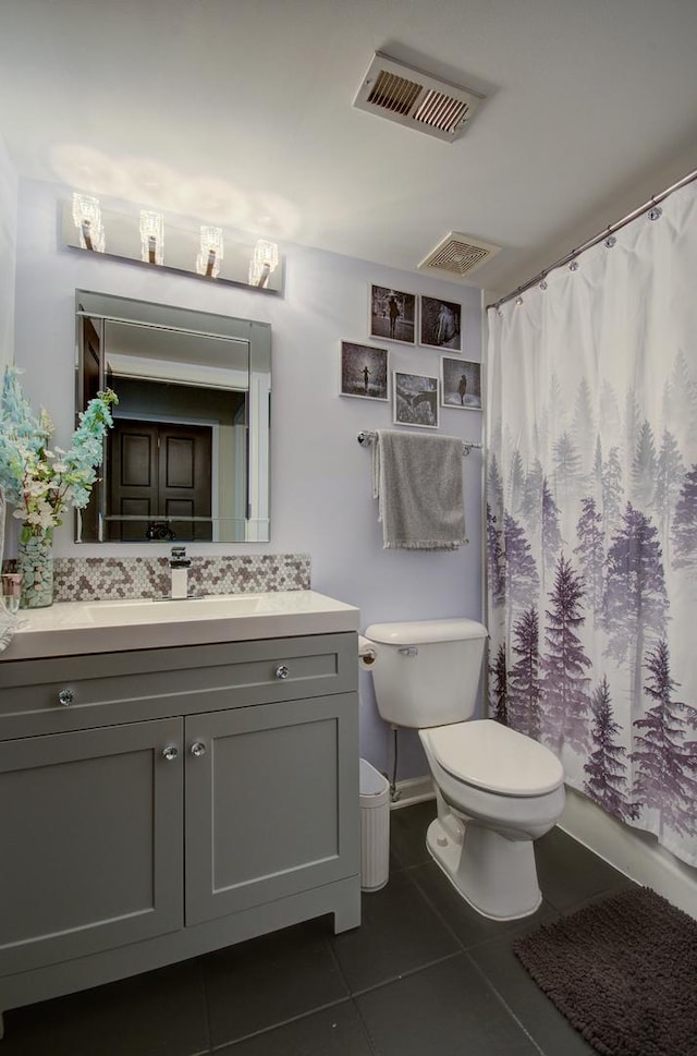 14121 Norwich Ln Unit 301, Orland Park, IL 60467 - bathroom featuring toilet, tile patterned flooring, vanity, and backsplash