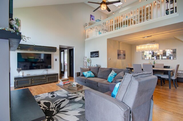 14121 Norwich Ln Unit 301, Orland Park, IL 60467 - living room with a ceiling fan, wood finished floors, a chandelier, and a high ceiling