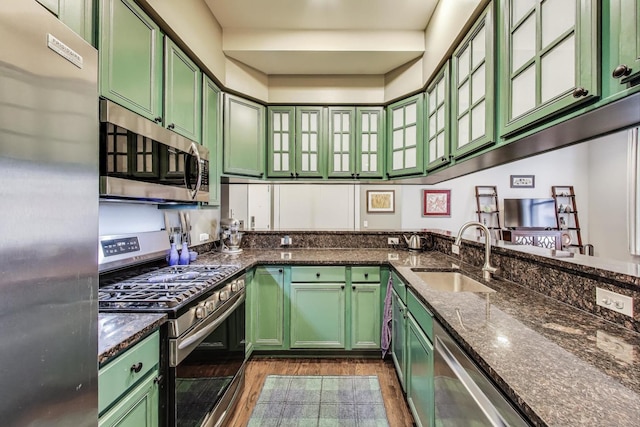 888 S Michigan Ave Unit 601, Chicago, IL 60605 - kitchen with stainless steel appliances, green cabinetry, and dark stone countertops