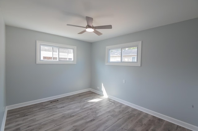 620 Ashland St, Hoffman Estates, IL 60169 - spare room with ceiling fan, dark wood-type flooring, and baseboards