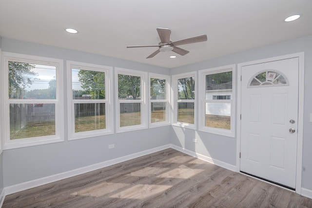 620 Ashland St, Hoffman Estates, IL 60169 - unfurnished sunroom with healthy amount of natural light, wood finished floors, recessed lighting, and baseboards