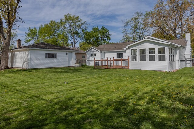 620 Ashland St, Hoffman Estates, IL 60169 - back of house with a chimney, a yard, a deck, and an outdoor structure