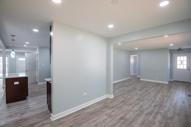 620 Ashland St, Hoffman Estates, IL 60169 - unfurnished living room with recessed lighting, light wood-style flooring, and baseboards
