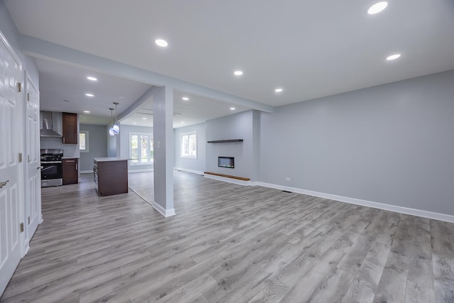 620 Ashland St, Hoffman Estates, IL 60169 - unfurnished living room with light wood-style floors, recessed lighting, baseboards, and a large fireplace
