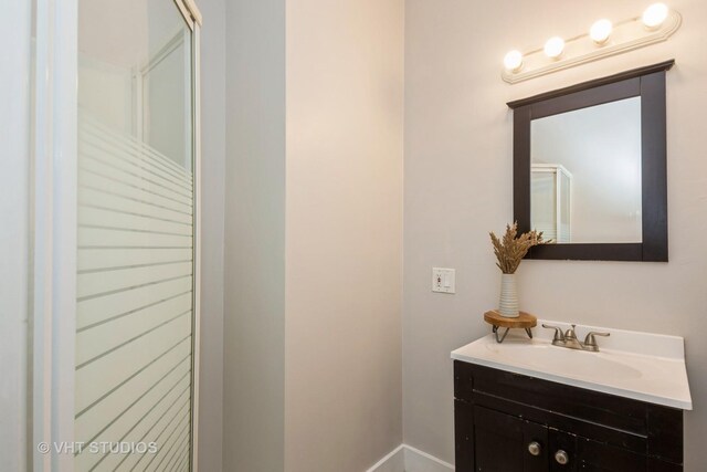 3540 S Prairie Ave Unit 1, Chicago, IL 60653 - bathroom with vanity and baseboards