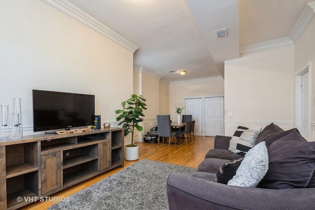 3540 S Prairie Ave Unit 1, Chicago, IL 60653 - living room with ornamental molding, light wood-type flooring, and a wainscoted wall
