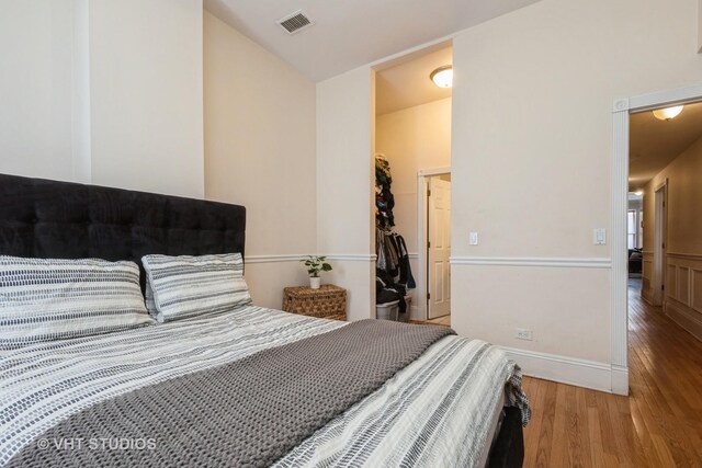 3540 S Prairie Ave Unit 1, Chicago, IL 60653 - bedroom with wood finished floors, a spacious closet, and a closet