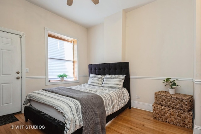 3540 S Prairie Ave Unit 1, Chicago, IL 60653 - bedroom with light wood finished floors, ceiling fan, and baseboards