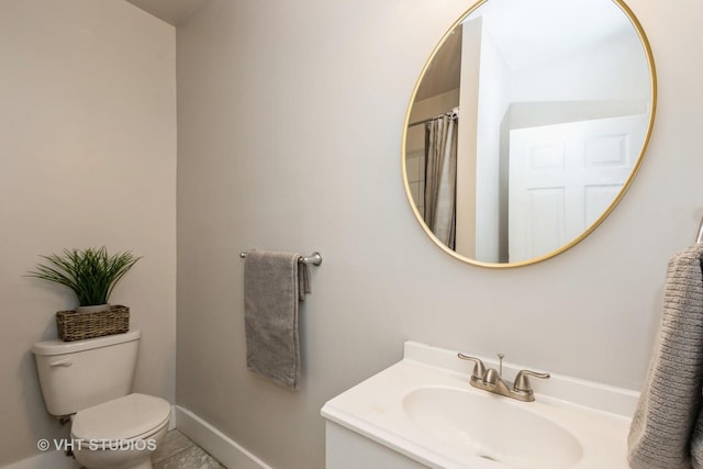 3540 S Prairie Ave Unit 1, Chicago, IL 60653 - bathroom with toilet, vanity, and baseboards