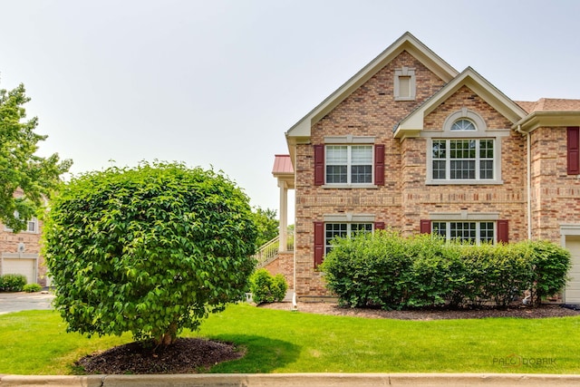 1296 Ashley Ct, Vernon Hills, IL 60061 - view of front of home with brick siding and a front lawn