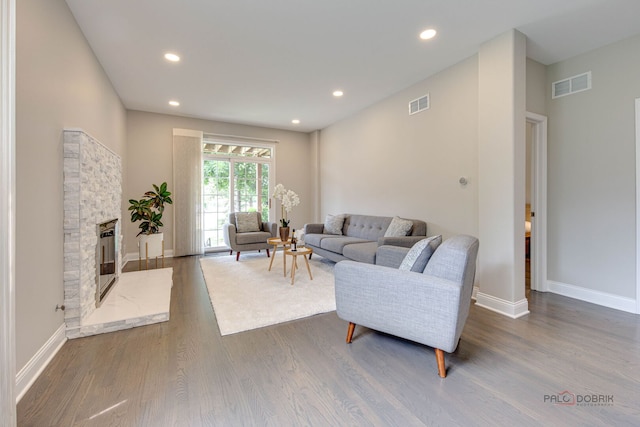 1296 Ashley Ct, Vernon Hills, IL 60061 - living area with wood finished floors, recessed lighting, and a stone fireplace